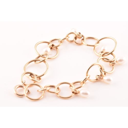 54 - A 9ct yellow gold and pearl hoop link bracelet, together with a pair of matching 9ct yellow gold and... 