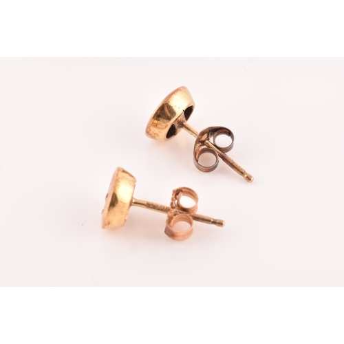 56 - A pair of 14ct yellow gold flower earrings, together with a pair of 9ct yellow gold studs, set with ... 