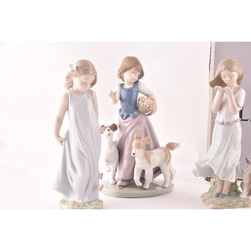 247 - A collection of Lladro figures to include a girl and squirrel, a girl holding a flower basket accomp... 