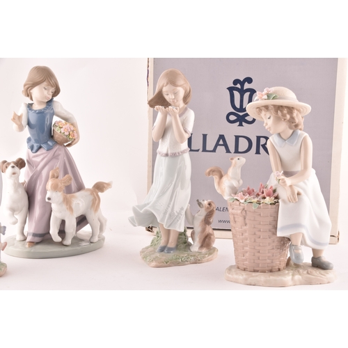 247 - A collection of Lladro figures to include a girl and squirrel, a girl holding a flower basket accomp... 