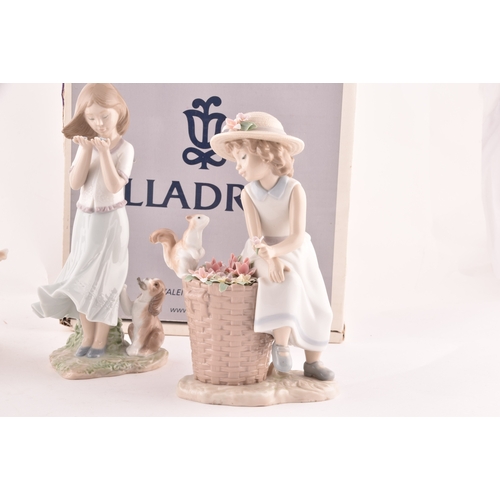 247 - A collection of Lladro figures to include a girl and squirrel, a girl holding a flower basket accomp... 