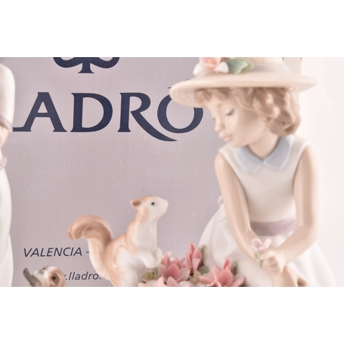 247 - A collection of Lladro figures to include a girl and squirrel, a girl holding a flower basket accomp... 