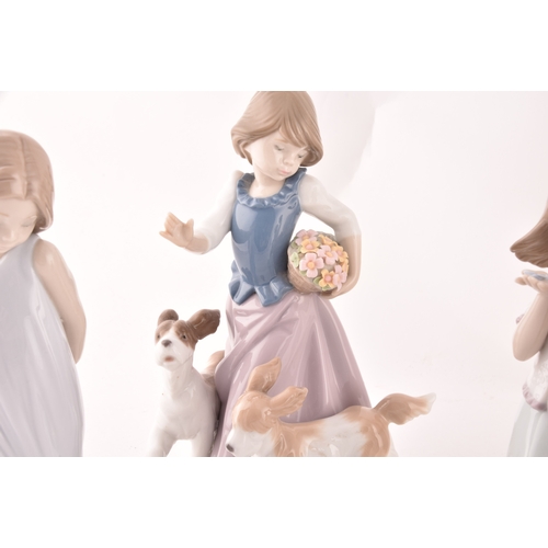 247 - A collection of Lladro figures to include a girl and squirrel, a girl holding a flower basket accomp... 