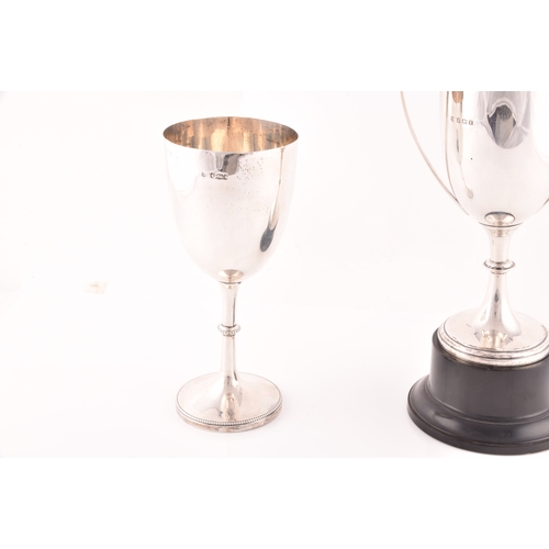 155 - Two silver trophies, a Victorian silver trophy, hallmarked for Sheffield 1893, and a George V silver... 