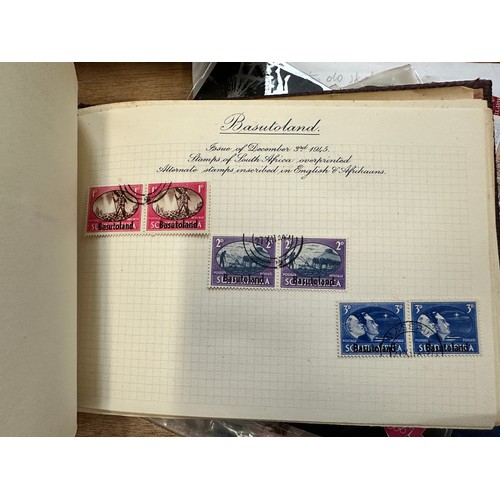 268 - World Stamps. A quantity of albums and material, world stamps including India, 1937 Coronation album... 