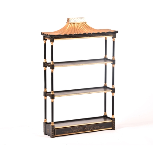 304 - A 20th century oriental design black and gilt wall shelf, the top with pergoda style pediment, three... 