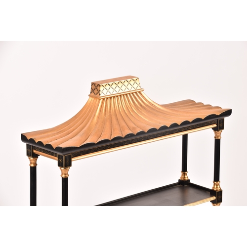 304 - A 20th century oriental design black and gilt wall shelf, the top with pergoda style pediment, three... 