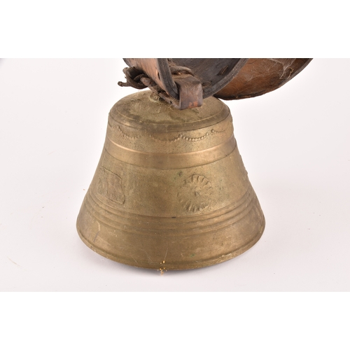 261 - A 19th century Swiss brass cowbell, the bell decorated with flowers, garlands and the Swiss cross, s... 