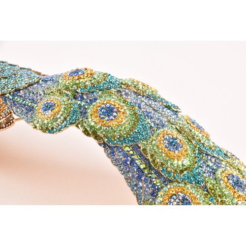 59 - A very large Butler & Wilson peacock shoulder adornment, set with coloured diamante stones on a ... 