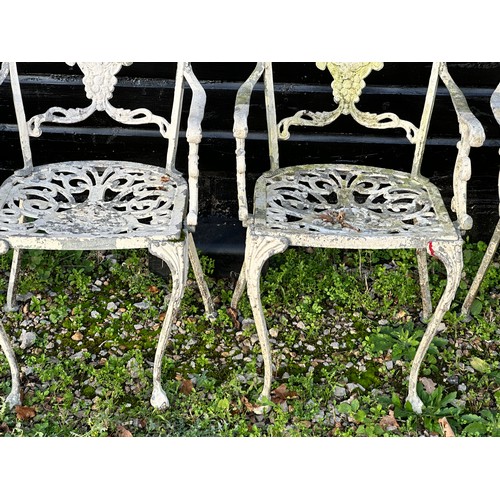 308 - A Victorian cast iron marble topped garden table, together with a set of four cast and painted alumi... 