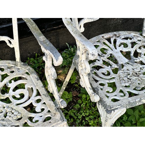 308 - A Victorian cast iron marble topped garden table, together with a set of four cast and painted alumi... 