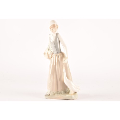 247A - A group of Lladro figures to include a girl with dog, a shepherdess, a Japanese geisha, a Lladro Roy... 