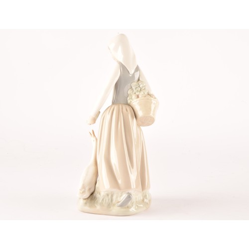 247A - A group of Lladro figures to include a girl with dog, a shepherdess, a Japanese geisha, a Lladro Roy... 