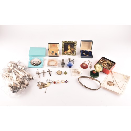 12 - A group of jewellery, including a 18ct yellow gold watch, a 9ct yellow gold sleeper earring and a 18... 