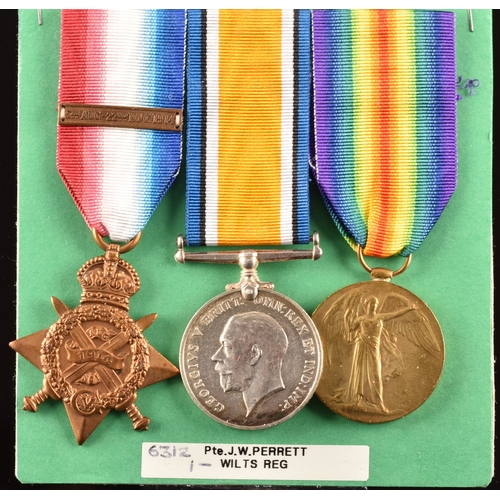 322 - A Great War medal trio to: 6312 Private J. W. Perrett, 1st Battalion, Wiltshire Regiment. Comprising... 