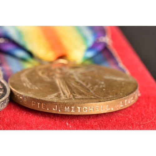 327 - A Great War medal trio to: 8376 Private J. Mitchell, 1st Battalion, Lincolnshire Regiment. Comprisin... 