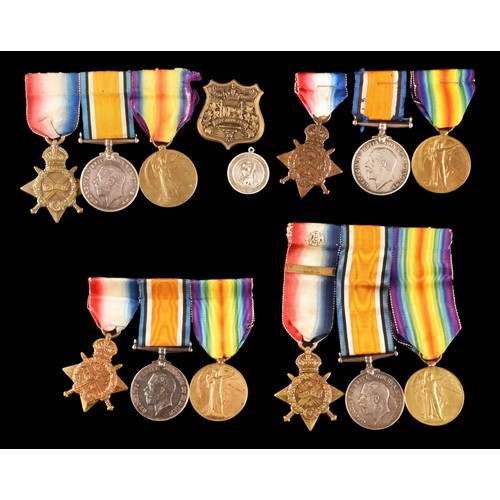 343 - Four Great War Medal Trios to:1. T-24371 Driver W. Forward, Army Service Corps, a 1914 Mons Star, th... 