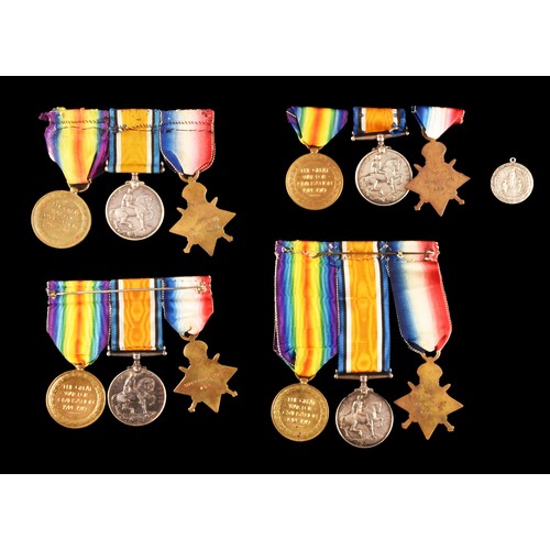 343 - Four Great War Medal Trios to:1. T-24371 Driver W. Forward, Army Service Corps, a 1914 Mons Star, th... 