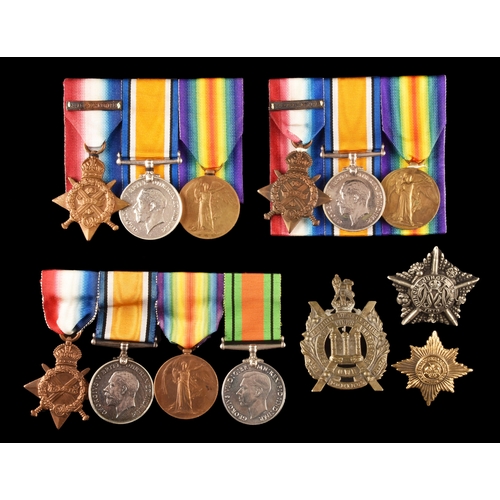 345 - Three Great War Medal Trios to:1. 3469 Private John Romayne, Irish Guards, a 1914 Mons Star (unnamed... 