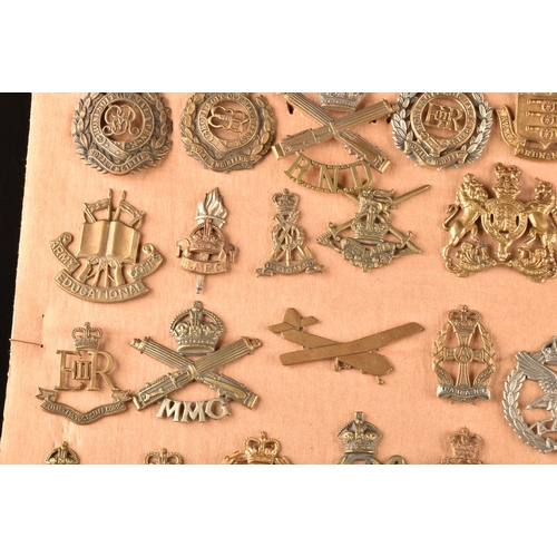 478 - A collection of military cap badges, including: Royal Engineers, Royal Naval Division, Royal Army Se... 