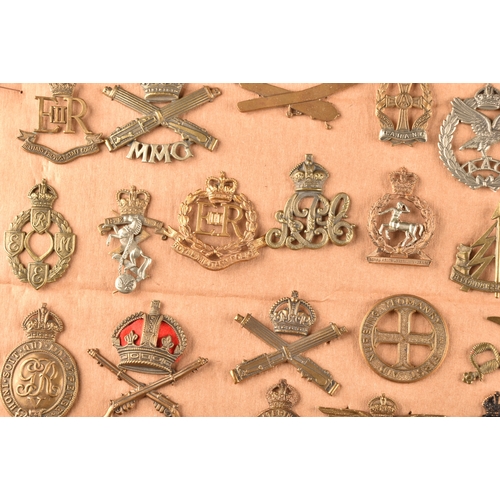 478 - A collection of military cap badges, including: Royal Engineers, Royal Naval Division, Royal Army Se... 