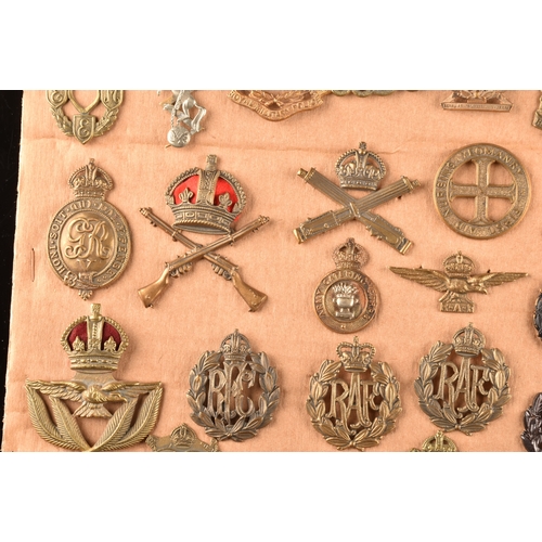 478 - A collection of military cap badges, including: Royal Engineers, Royal Naval Division, Royal Army Se... 