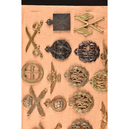 478 - A collection of military cap badges, including: Royal Engineers, Royal Naval Division, Royal Army Se... 