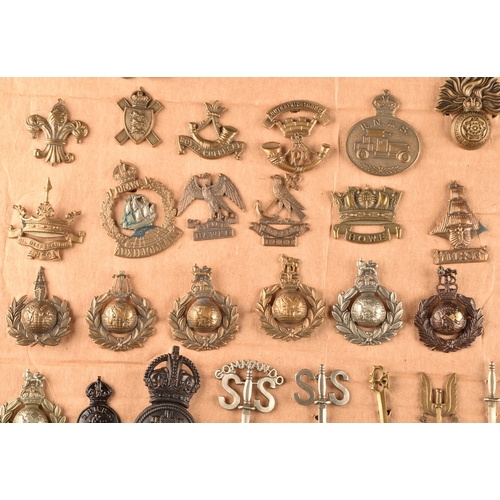 479 - A collection of military cap badges, including Monmouthshire Regiment, Hertfordshire Regiment, The C... 