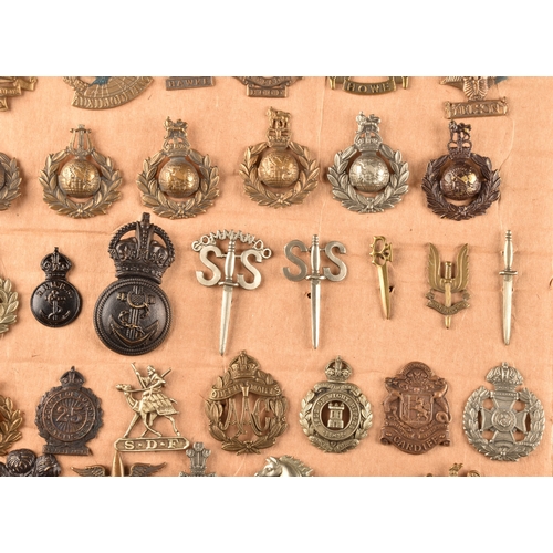 479 - A collection of military cap badges, including Monmouthshire Regiment, Hertfordshire Regiment, The C... 