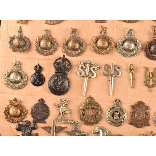 479 - A collection of military cap badges, including Monmouthshire Regiment, Hertfordshire Regiment, The C... 