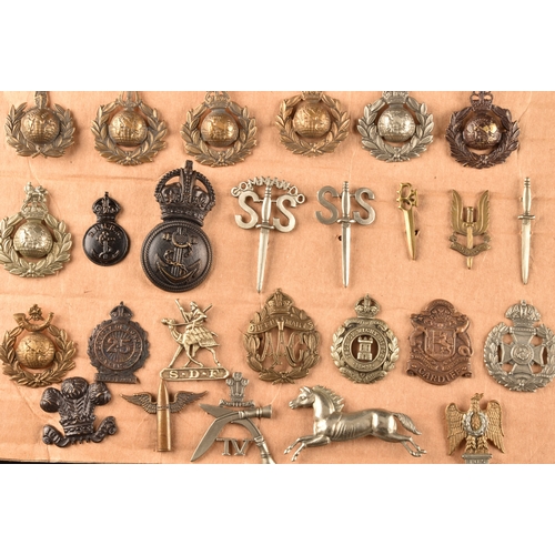 479 - A collection of military cap badges, including Monmouthshire Regiment, Hertfordshire Regiment, The C... 