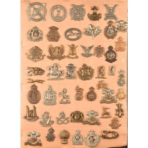 480 - A collection of military cap badges, including Highland Regiment, Lovat's Scouts, Scottish Horse Reg... 