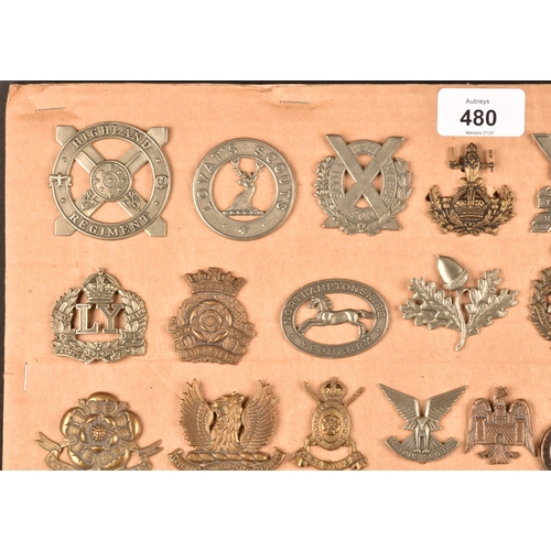 480 - A collection of military cap badges, including Highland Regiment, Lovat's Scouts, Scottish Horse Reg... 