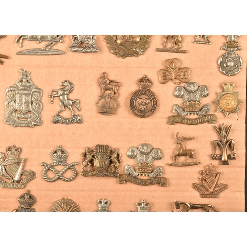 480 - A collection of military cap badges, including Highland Regiment, Lovat's Scouts, Scottish Horse Reg... 