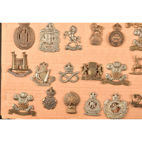 480 - A collection of military cap badges, including Highland Regiment, Lovat's Scouts, Scottish Horse Reg... 