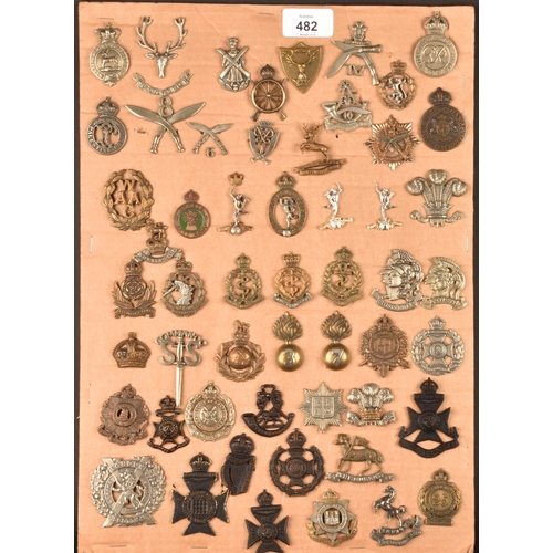 482 - A collection of military and police cap badges including Hertfordshire Constabulary, Palestine Polic... 