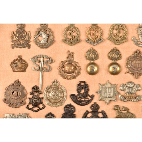 482 - A collection of military and police cap badges including Hertfordshire Constabulary, Palestine Polic... 