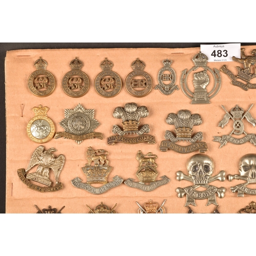 483 - A collection of military cap badges including: First Life Guards, Second Life Guards, Royal Horse Gu... 