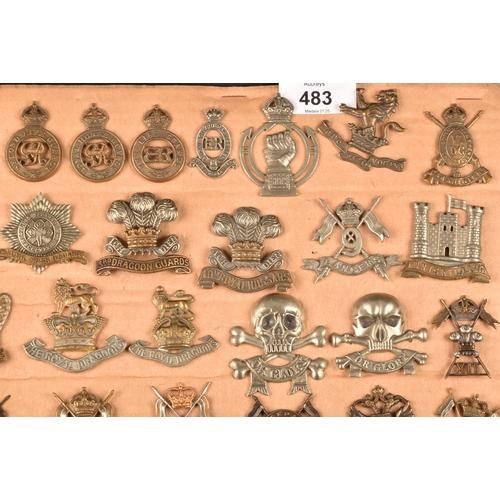 483 - A collection of military cap badges including: First Life Guards, Second Life Guards, Royal Horse Gu... 