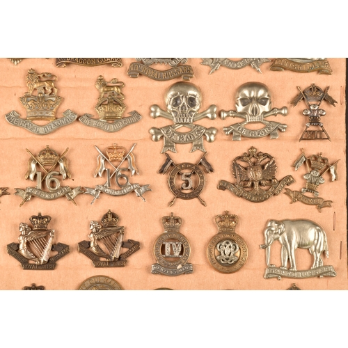 483 - A collection of military cap badges including: First Life Guards, Second Life Guards, Royal Horse Gu... 