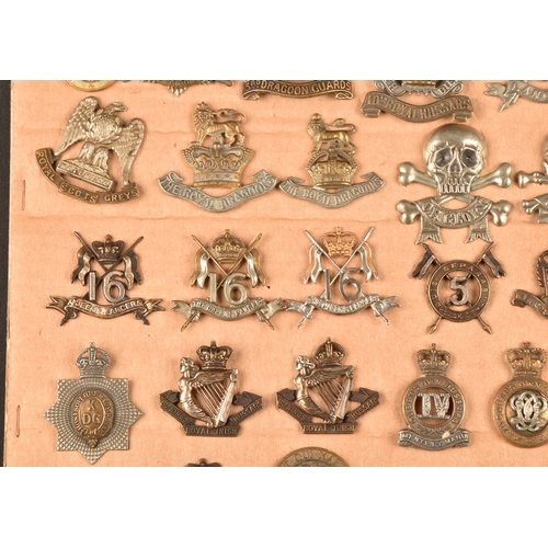 483 - A collection of military cap badges including: First Life Guards, Second Life Guards, Royal Horse Gu... 