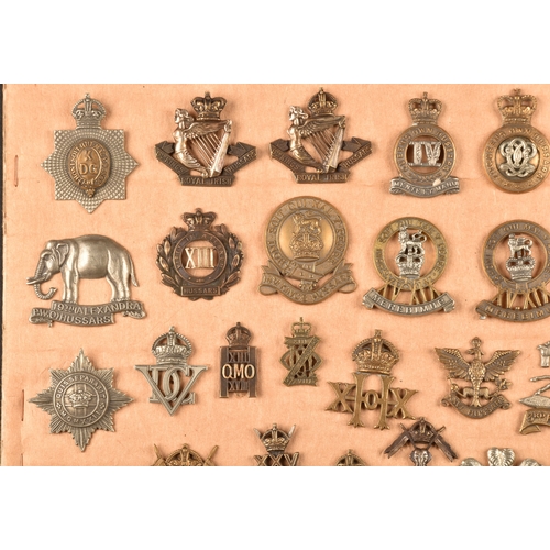 483 - A collection of military cap badges including: First Life Guards, Second Life Guards, Royal Horse Gu... 