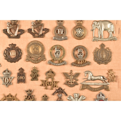 483 - A collection of military cap badges including: First Life Guards, Second Life Guards, Royal Horse Gu... 