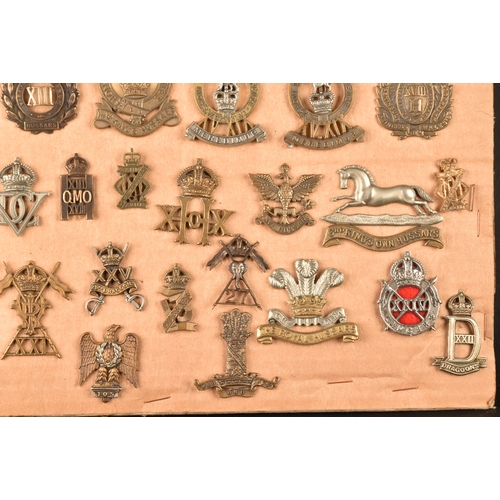 483 - A collection of military cap badges including: First Life Guards, Second Life Guards, Royal Horse Gu... 