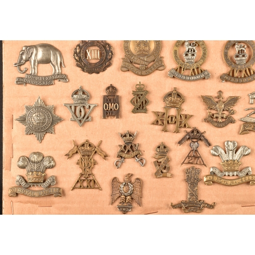 483 - A collection of military cap badges including: First Life Guards, Second Life Guards, Royal Horse Gu... 