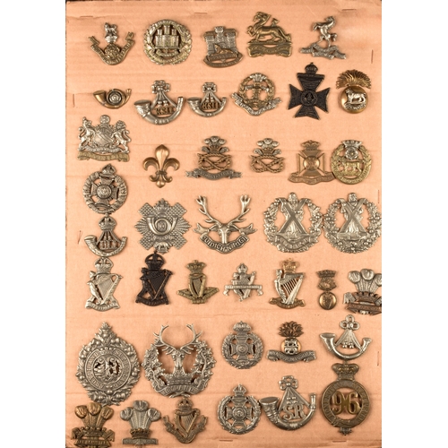 484 - A collection of military cap badges including Loyal North Lancashire Regiment, Northamptonshire Regi... 