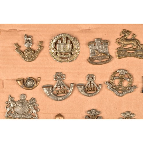 484 - A collection of military cap badges including Loyal North Lancashire Regiment, Northamptonshire Regi... 