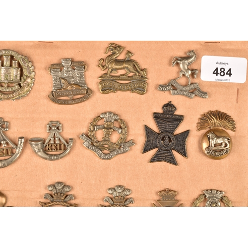 484 - A collection of military cap badges including Loyal North Lancashire Regiment, Northamptonshire Regi... 