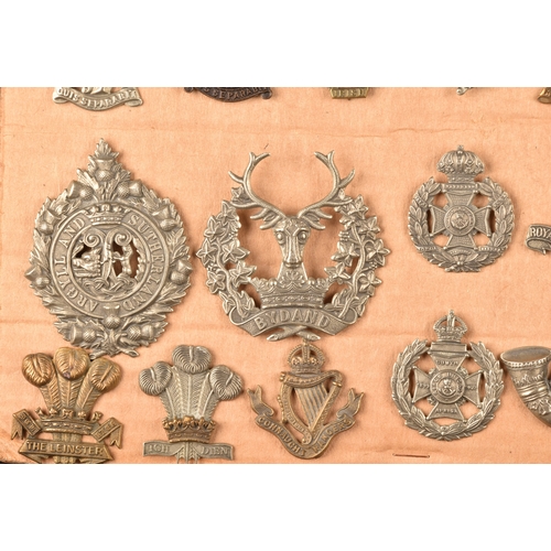 484 - A collection of military cap badges including Loyal North Lancashire Regiment, Northamptonshire Regi... 