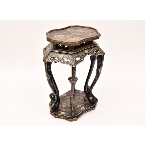 206 - A large Japanese black lacquer jardiniere stand, the top deorated with an extensive mountainous lans... 